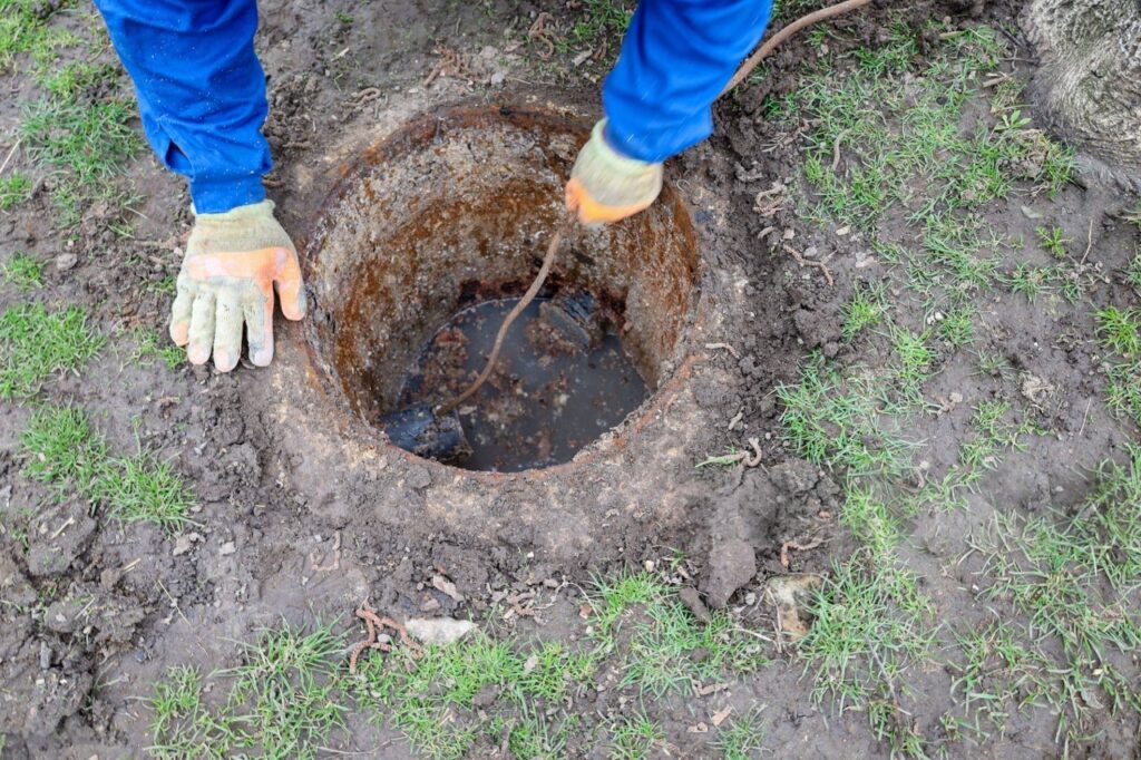 Drain cleaning in Lindon by Summit Plumbing Pros at an outdoor sewer cleanout.